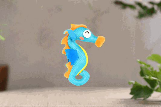 GiGwi Dental Mesh Catnip Seahorse toy for cats, featuring a seahorse-shaped design with a textured mesh surface, bright colors, and a catnip scent. The toy is designed to help clean cats' teeth while they play.