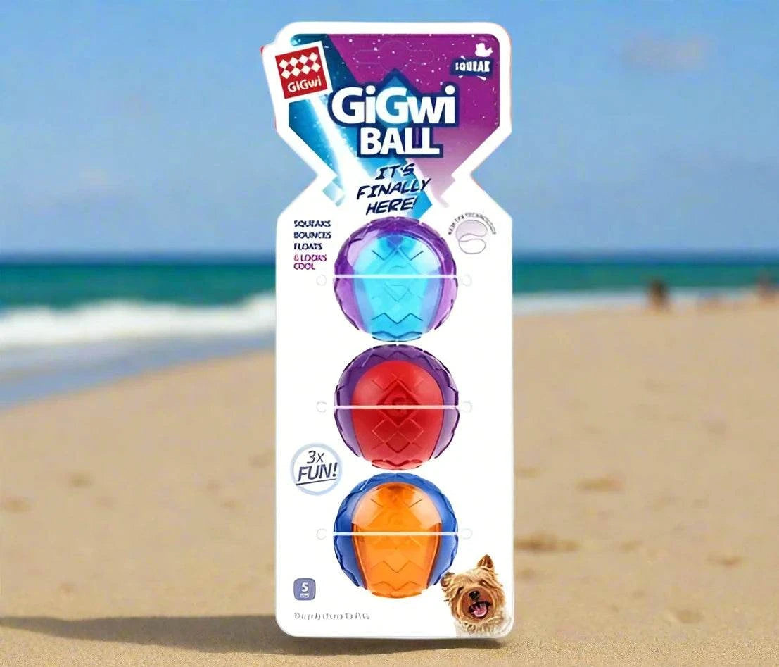 GiGwi Original Fetch Ball for dogs, featuring a durable Thermoplastic Rubber (TPR) construction, bright colorful design, and an internal squeaker. The ball is shown floating in water, highlighting its versatility for both land and water play.