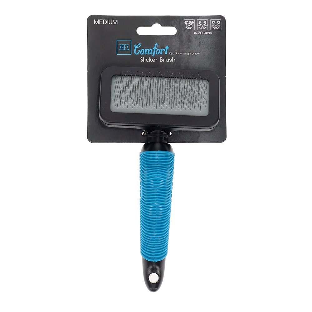 ZEEZ Comfort Slicker Brush resting on a grooming table with pet accessories.
